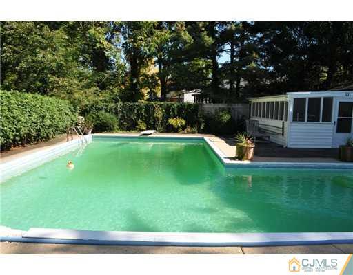 9 Agate Road East Brunswick, NJ 08816 - Photo 9 of 19 a view of backyard with swimming pool