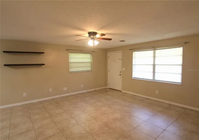 a view of an empty room with a window