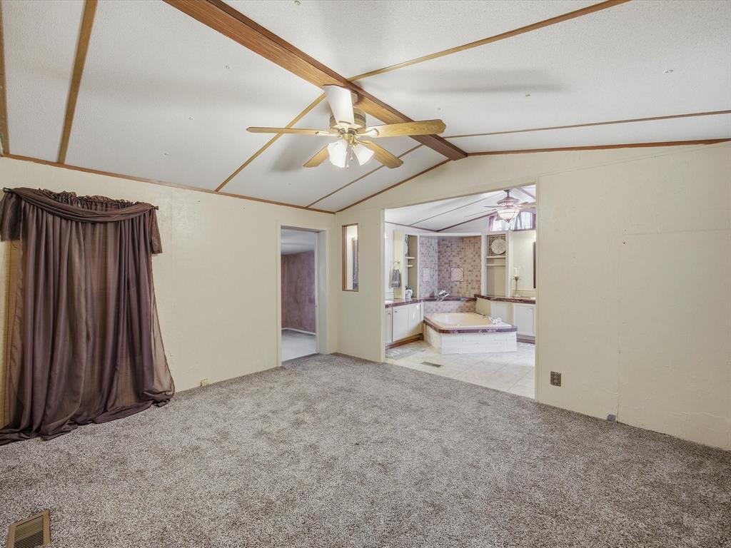 196 Perch Road Bowie, TX 76230 - Photo 12 of 33 a view of empty room with wooden floor and fan