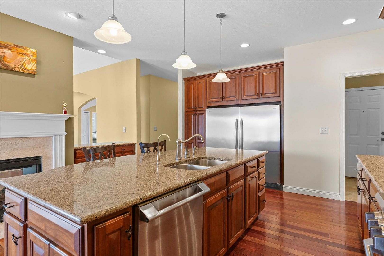 2595 500 East Mahomet, IL 61853 - Photo 15 of 84 a kitchen with stainless steel appliances granite countertop a kitchen island a stove and a refrigerator