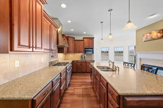 a bathroom with a sink a mirror and a light fixture