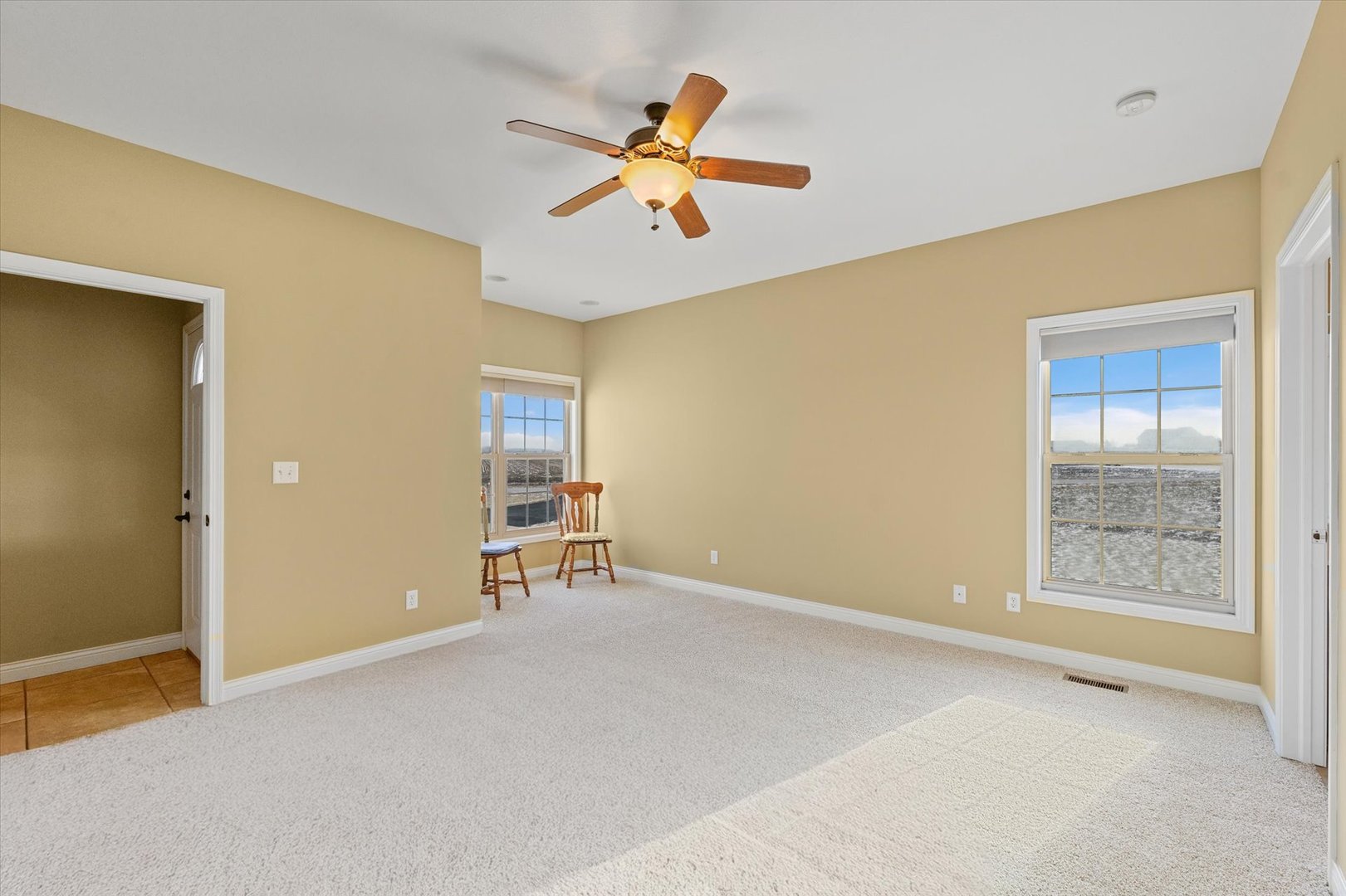 2595 500 East Mahomet, IL 61853 - Photo 23 of 84 wooden floor in an empty room with a window