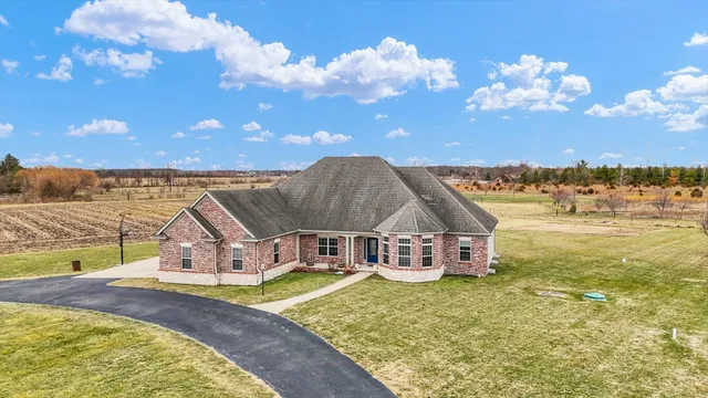 a view of a house with outdoor space and sitting area