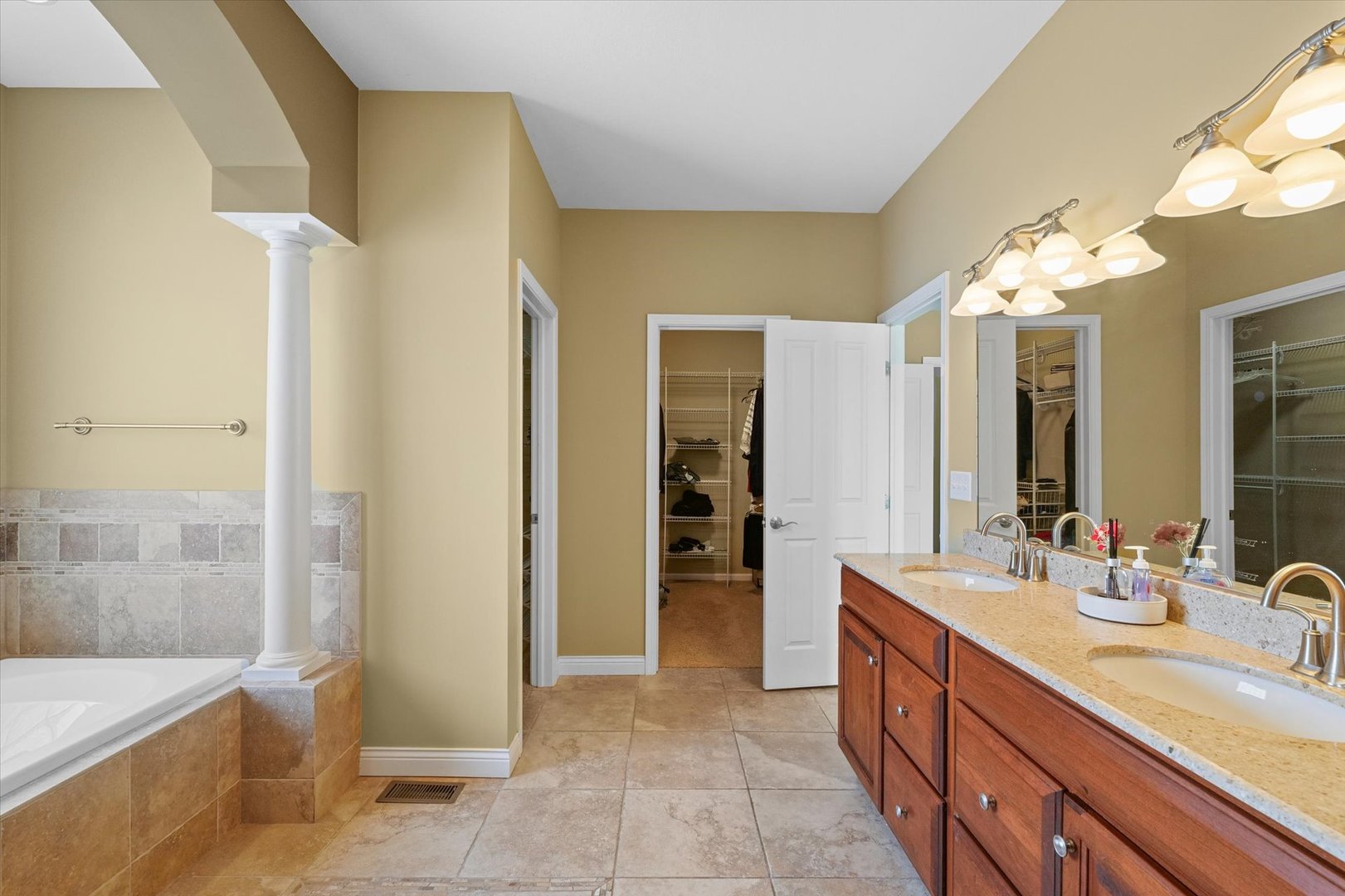 2595 500 East Mahomet, IL 61853 - Photo 37 of 84 a spacious bathroom with a double vanity sink a mirror and a shower