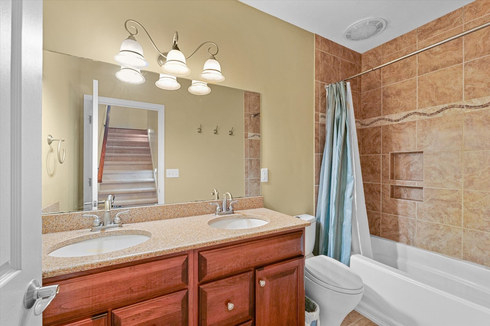 2595 500 East Mahomet, IL 61853 - Photo 47 of 84 a bathroom with a double vanity sink mirror and toilet