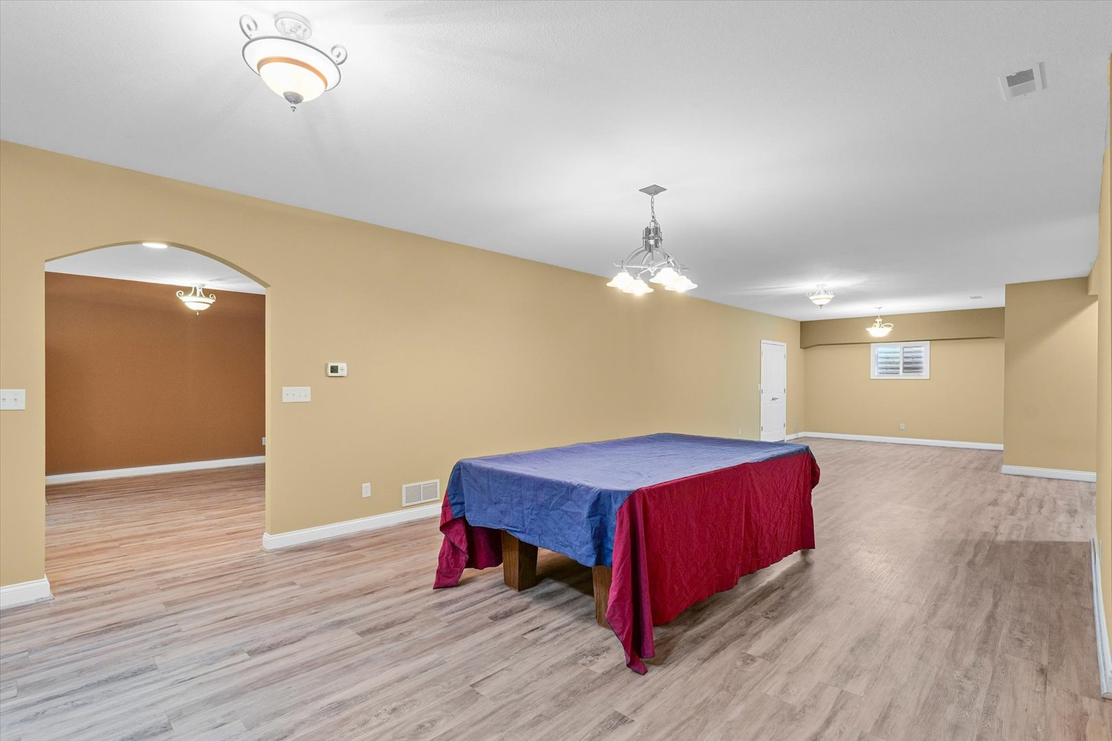 2595 500 East Mahomet, IL 61853 - Photo 48 of 84 a living room with a bed furniture and a wooden floor
