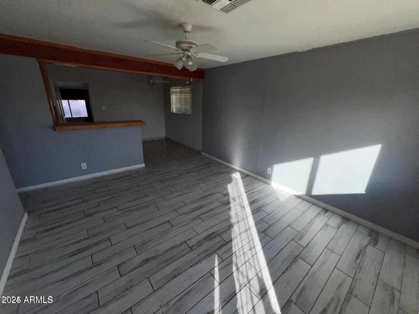 10244 North 18th Avenue Phoenix, AZ 85021 - Photo 2 of 4 a view of empty room with wooden floor