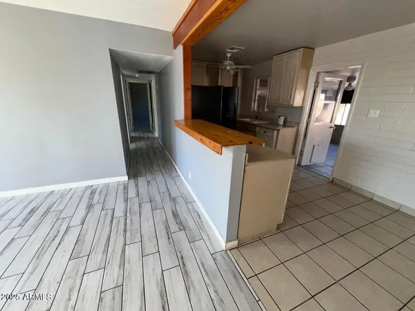 a view of a kitchen from the hallway