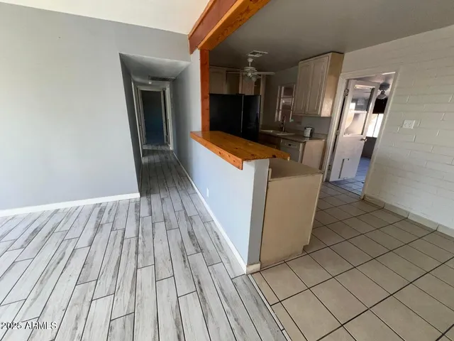 a view of a kitchen from the hallway