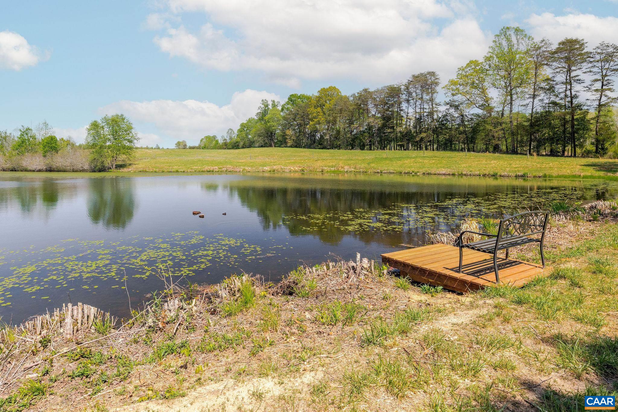 Tbd Cedar Plains Road Sandy Hook, VA 23153 - Photo 23 of 55 a view of a lake with a yard