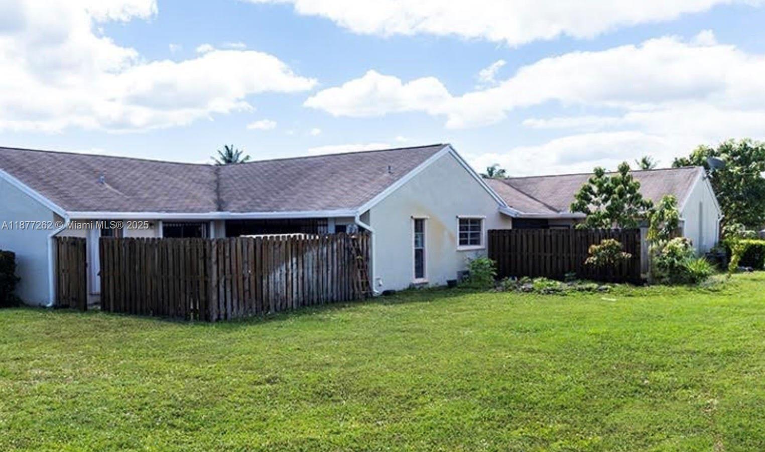 a house view with a garden space