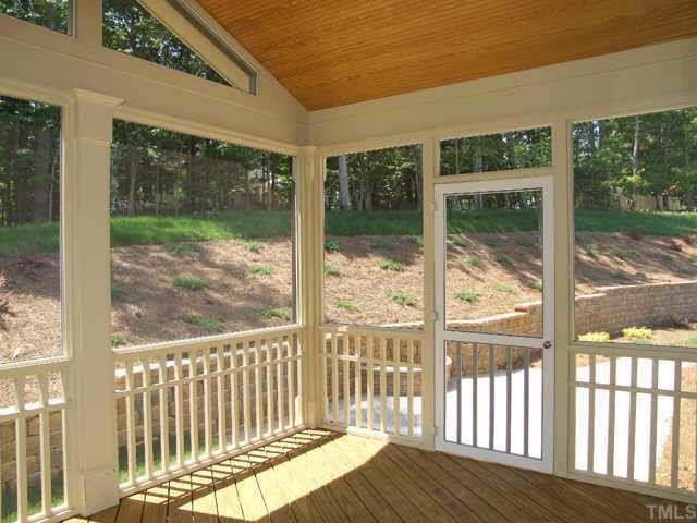 2605 Pathview Court Raleigh, NC 27613 - Photo 9 of 10 Handsome SCREEN PORCH with vaulted, stained beadboard ceiling...opens to stone paver patio and elegant rear entertaining area!