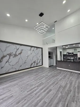 a view of a livingroom with wooden floor