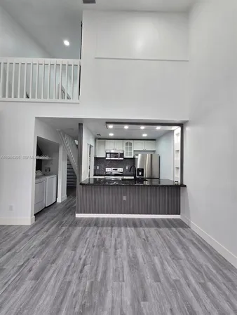 a view of kitchen and kitchen with sink