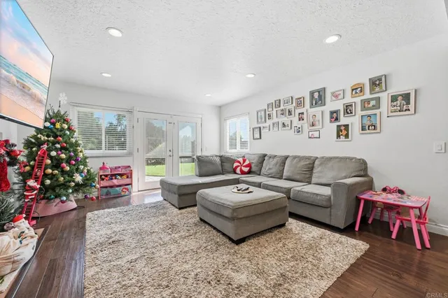 a living room with furniture and flowers