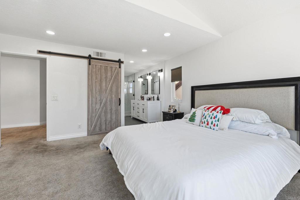 25252 Misty Ridge Mission Viejo, CA 92692 - Photo 23 of 42 a bedroom with a large bed and a cabinets