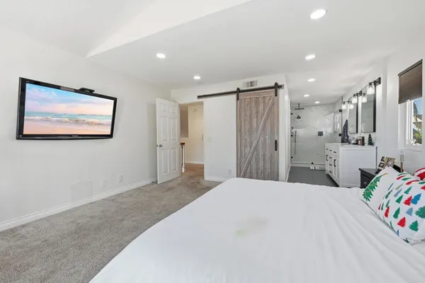 a bedroom with a bed and a walk in closet