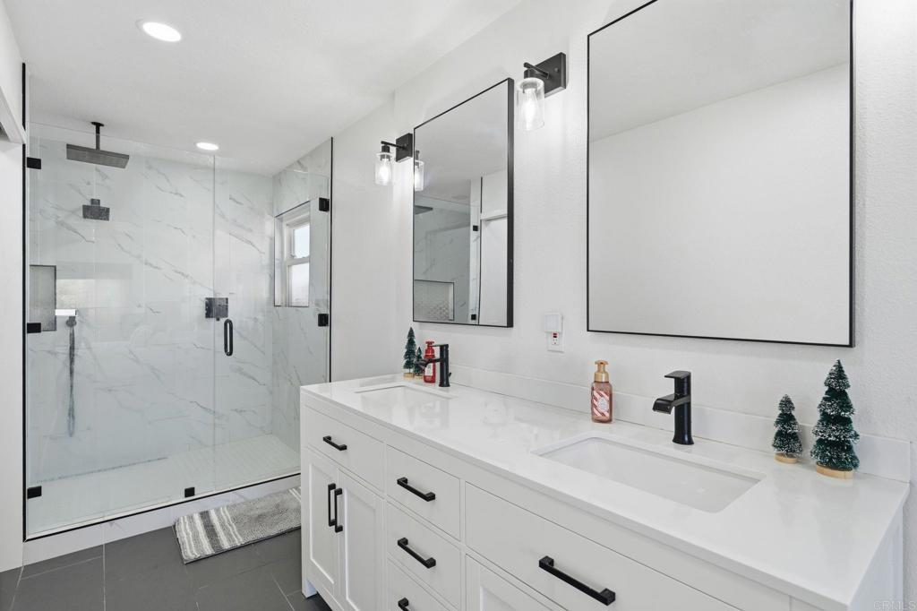 25252 Misty Ridge Mission Viejo, CA 92692 - Photo 25 of 42 a bathroom with a double vanity sink mirror double and shower