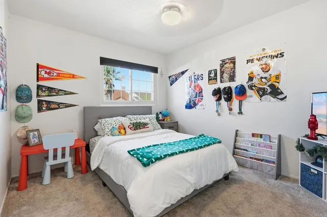 a bedroom with a bed and cabinets