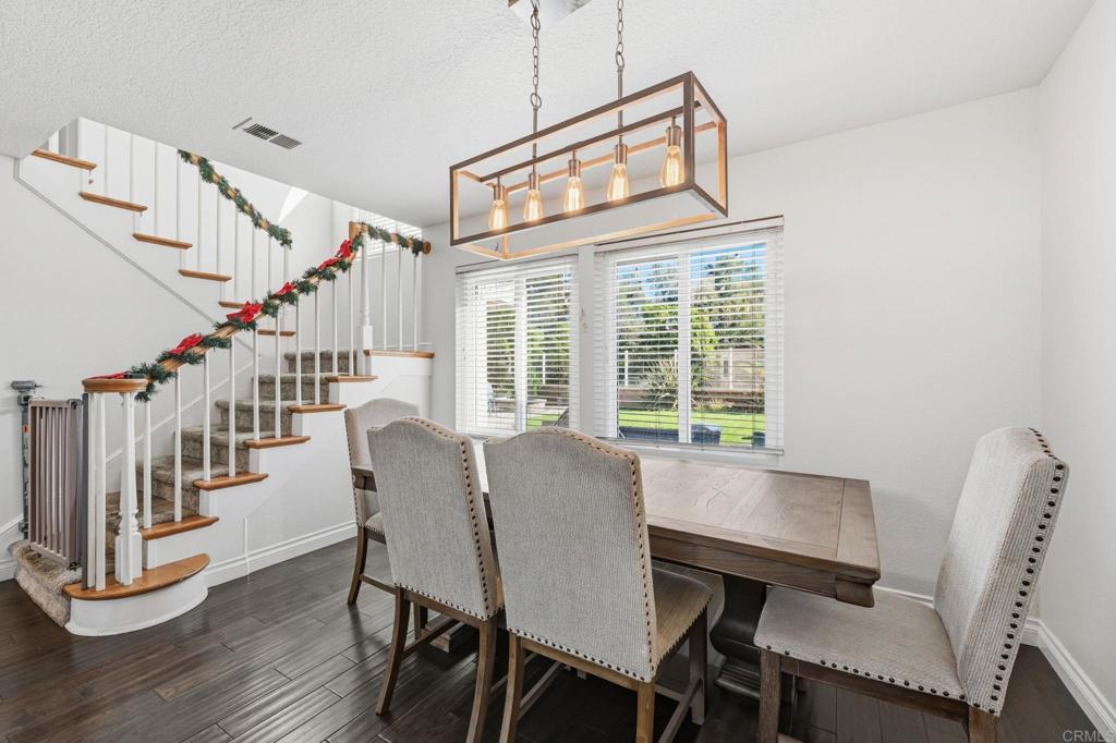 25252 Misty Ridge Mission Viejo, CA 92692 - Photo 9 of 42 a dining room with wooden floor and windows