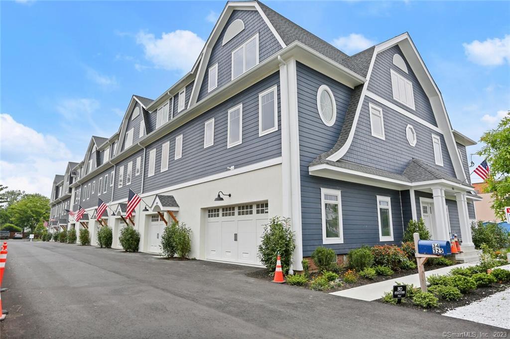 337 Reef Road, Unit 8 Fairfield, CT 06824 - Photo 1 of 1 a front view of a building with street view