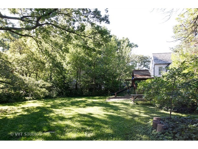 Undisclosed Address Western Springs, IL 60558 - Photo 2 of 7 a swimming pool with trees in the background