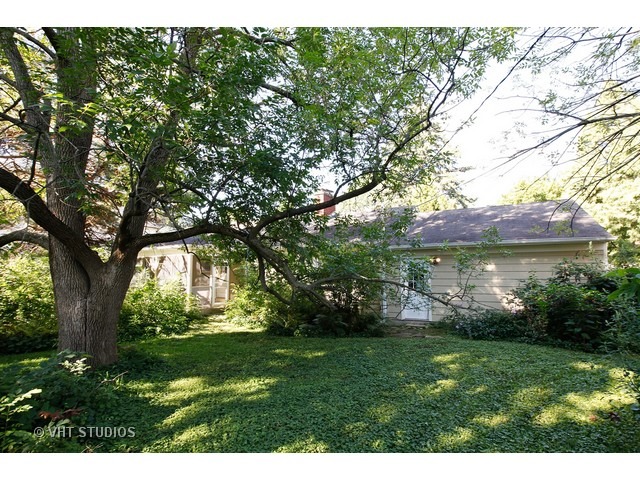Undisclosed Address Western Springs, IL 60558 - Photo 3 of 7 a view of a backyard with large trees