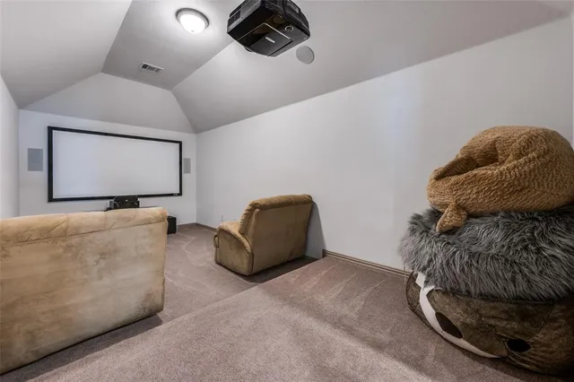 a bedroom with bed and a book shelf