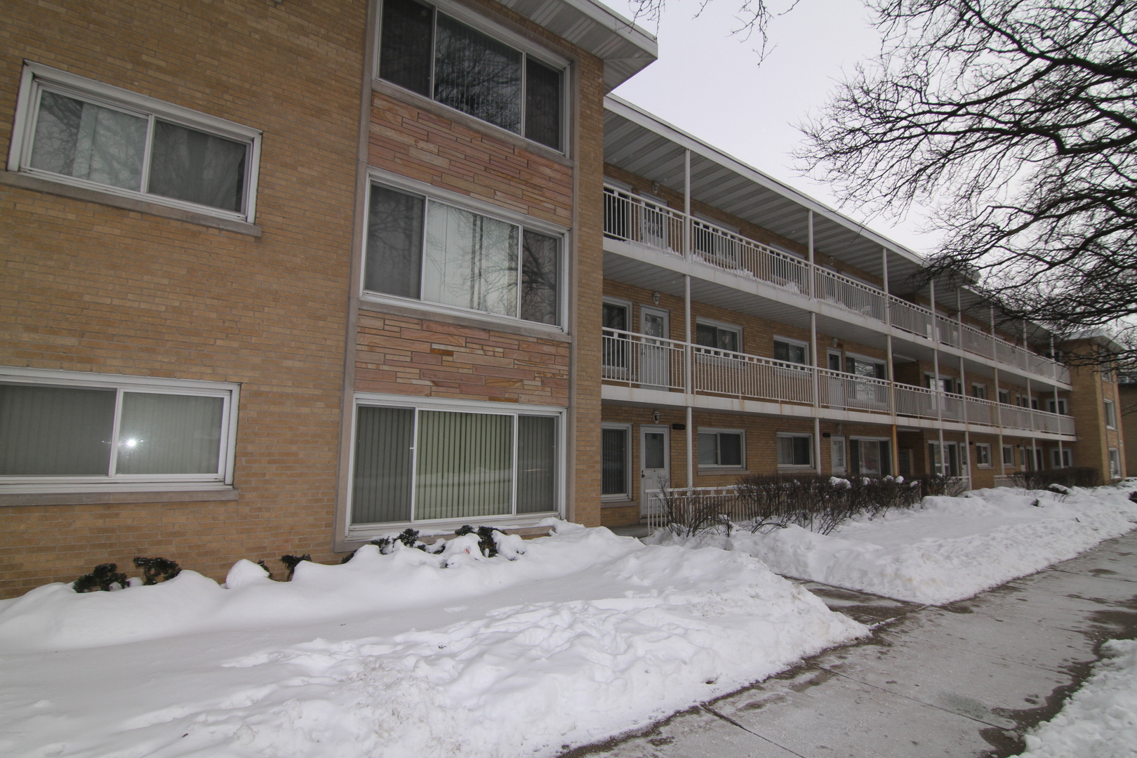 4909 North Harlem Avenue, Unit 1 Chicago, IL 60656 - Photo 1 of 8 a front view of a building with a yard