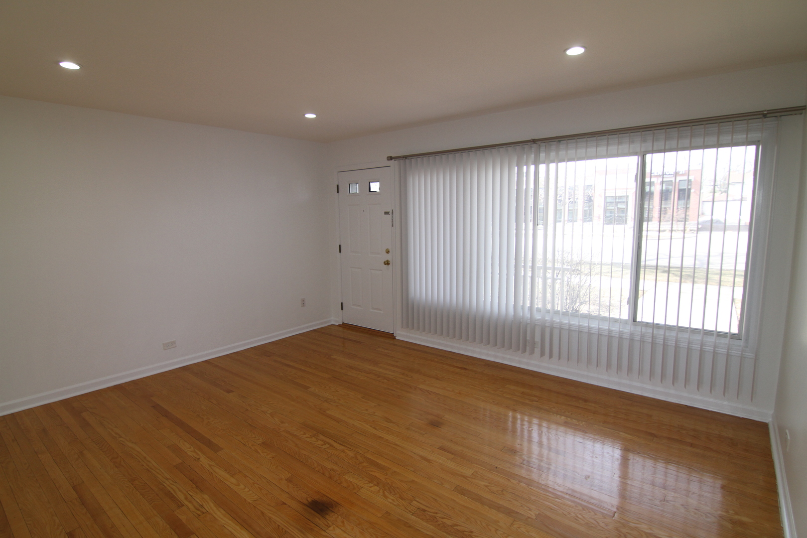 4909 North Harlem Avenue, Unit 1 Chicago, IL 60656 - Photo 3 of 8 a view of an empty room with a window