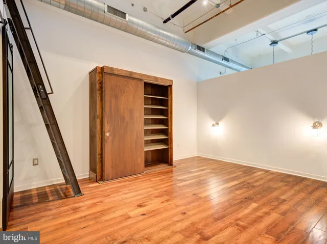 a view of an empty room with stairs