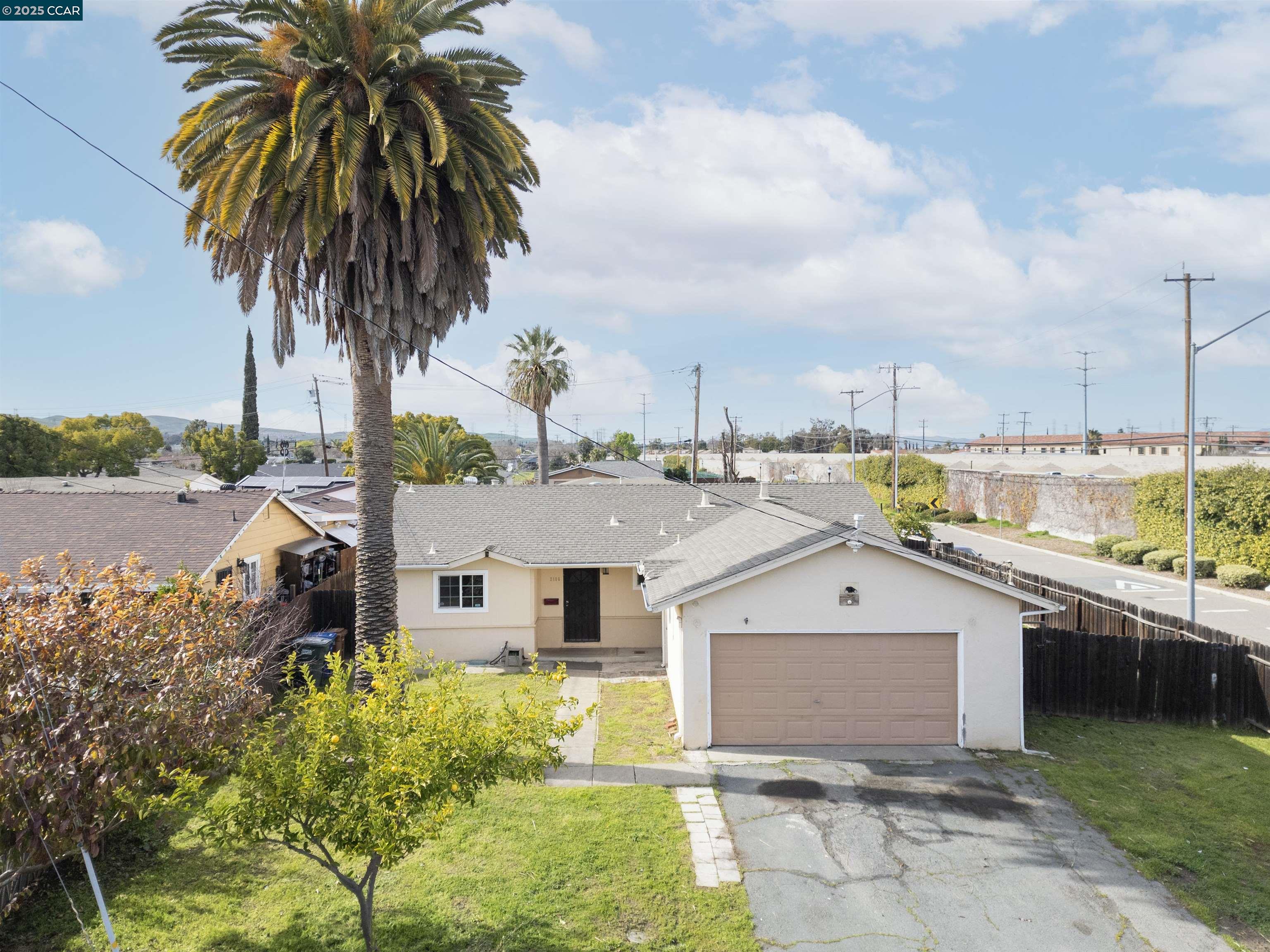 2106 Goff Avenue Pittsburg, CA 94565 - Photo 1 of 27 a front view of a house with a garden
