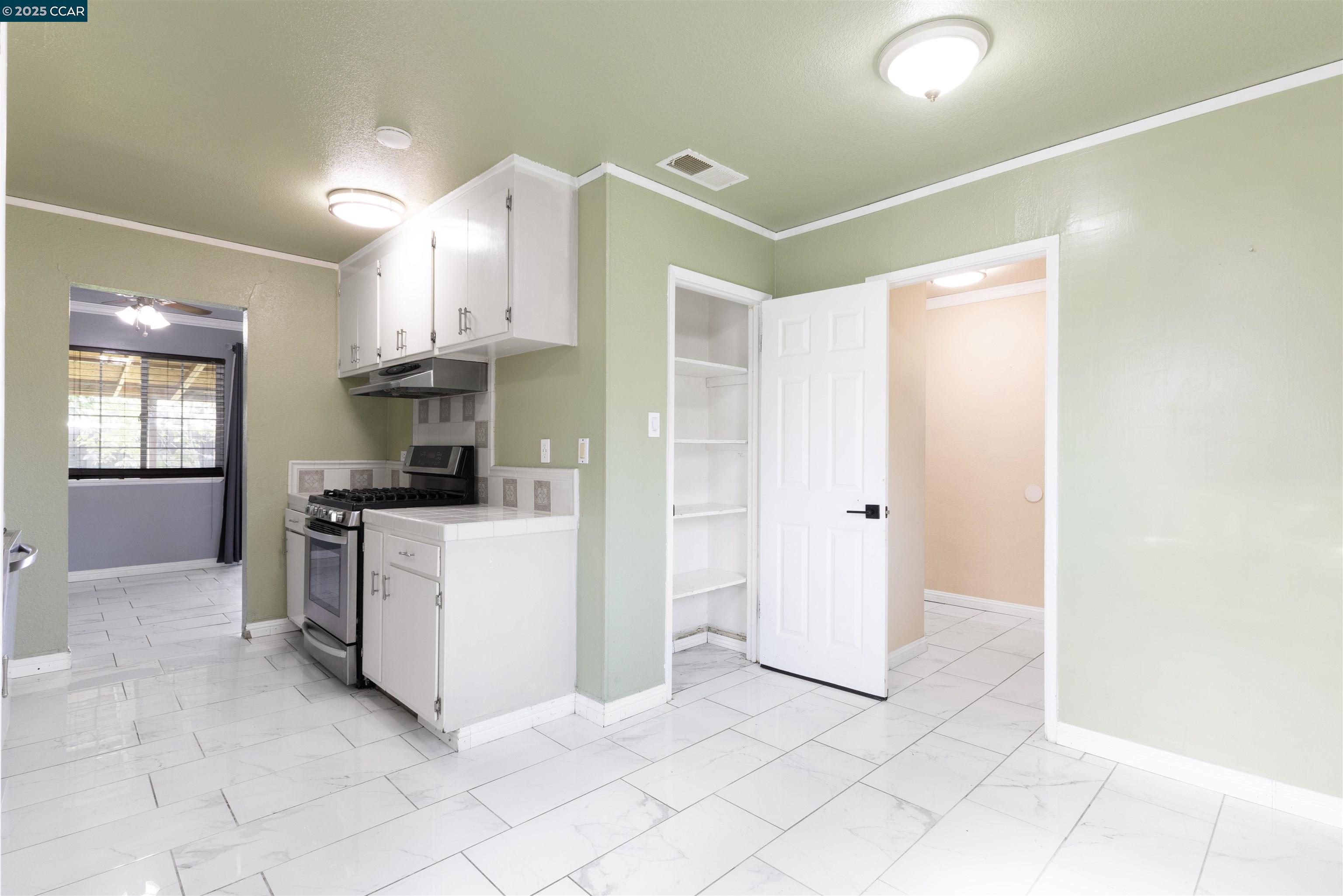 2106 Goff Avenue Pittsburg, CA 94565 - Photo 13 of 27 a kitchen with cabinets and stainless steel appliances