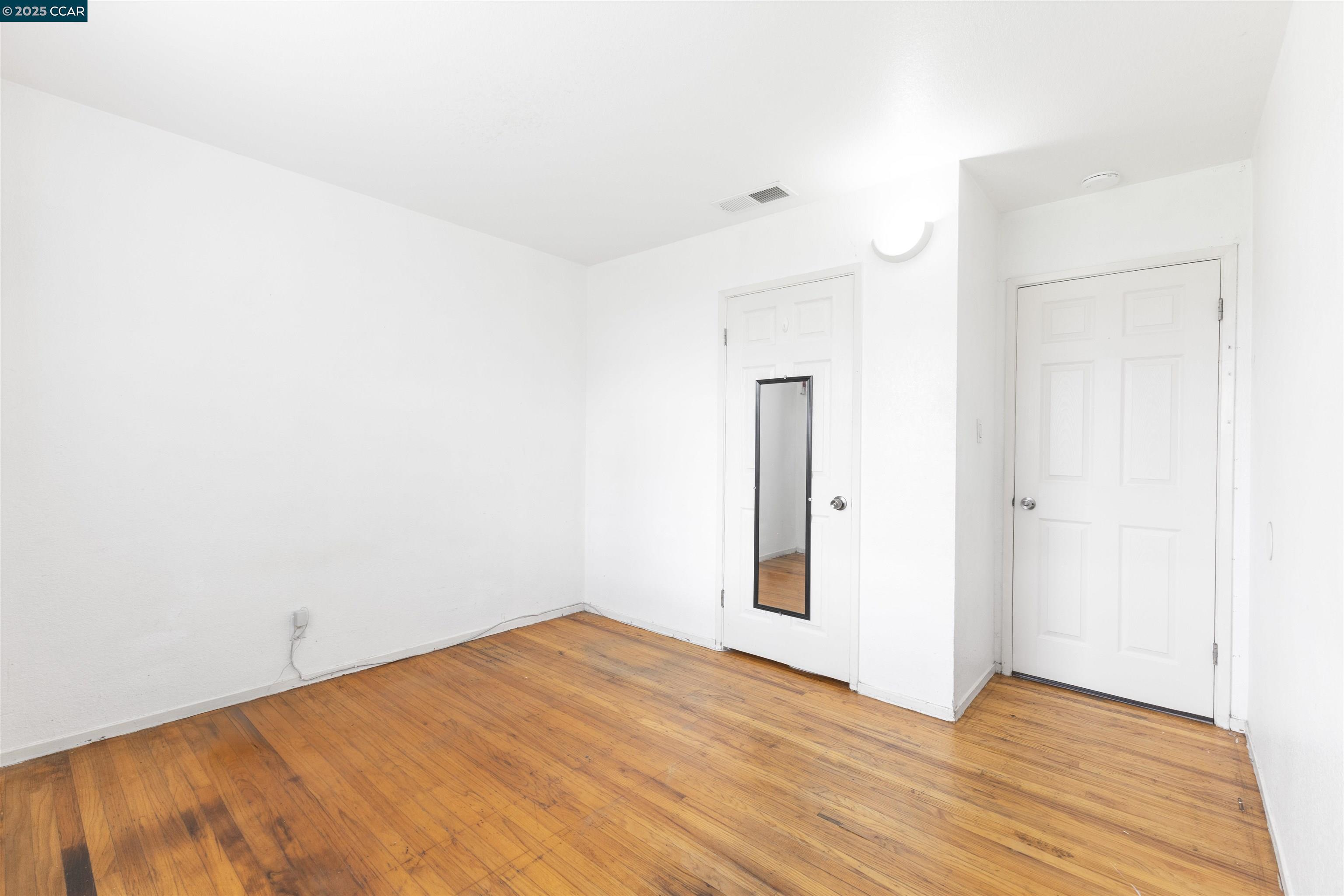 2106 Goff Avenue Pittsburg, CA 94565 - Photo 14 of 27 a view of empty room with wooden floor