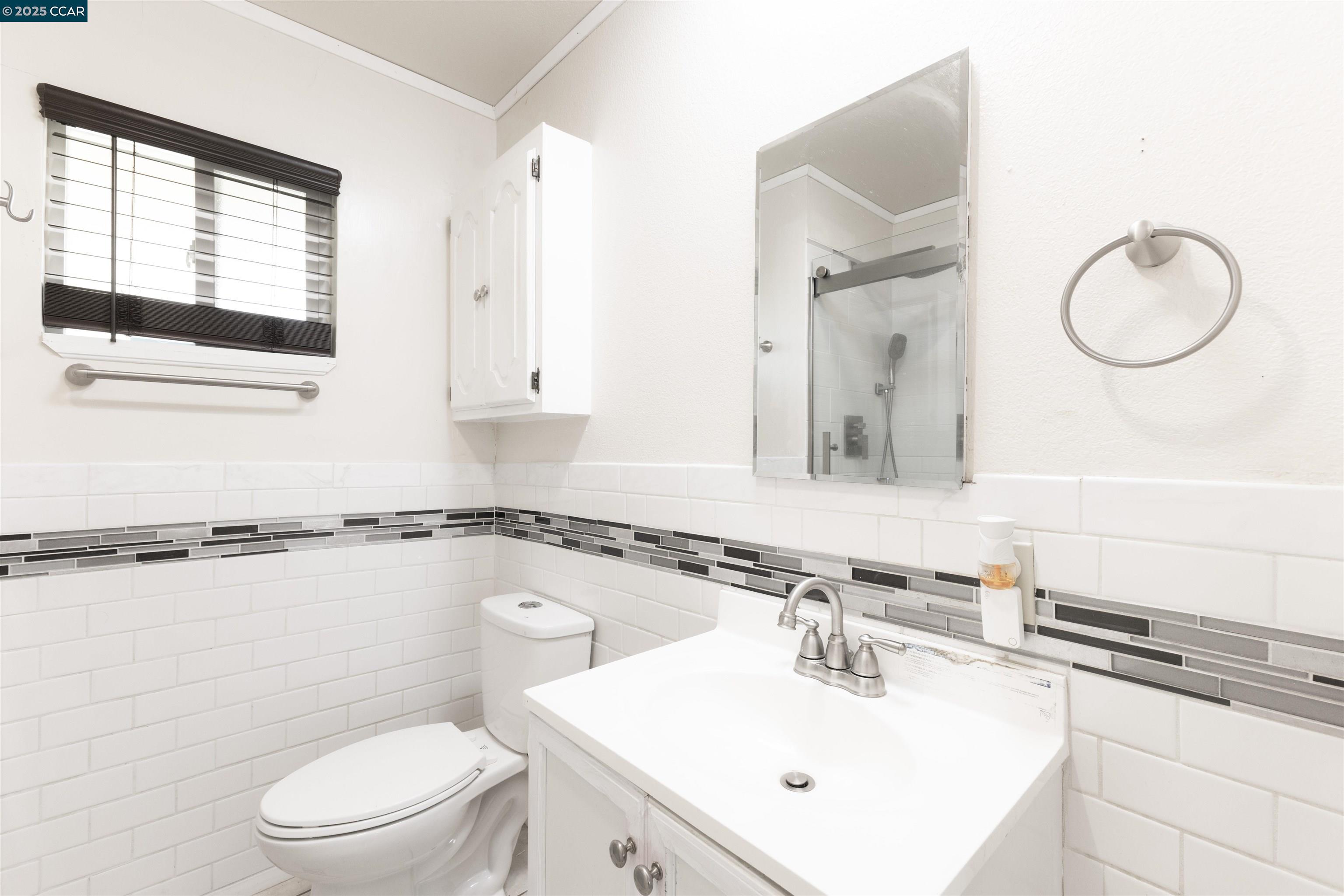 2106 Goff Avenue Pittsburg, CA 94565 - Photo 16 of 27 a bathroom with a sink a toilet and mirror