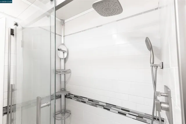 a bathroom with a sink a mirror and a shower