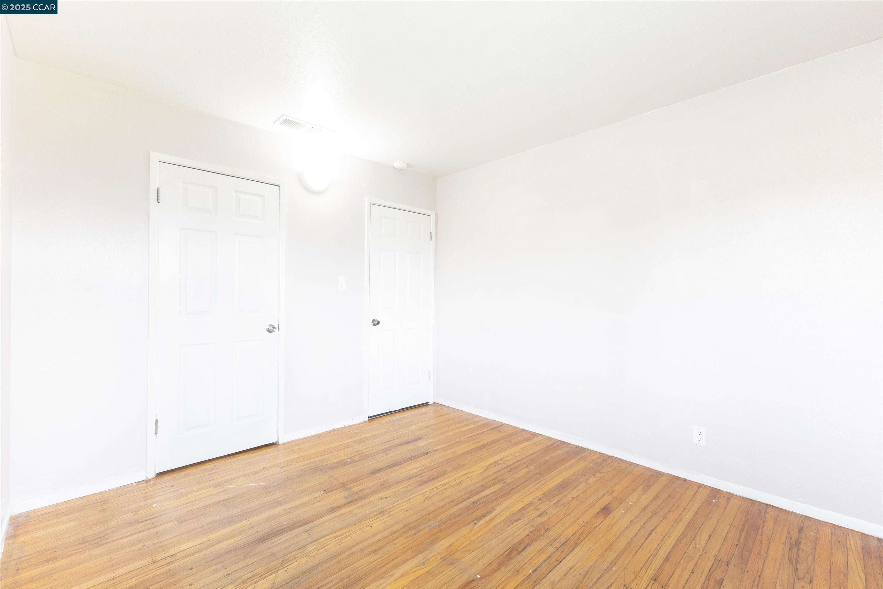 2106 Goff Avenue Pittsburg, CA 94565 - Photo 19 of 27 a view of empty room with wooden floor