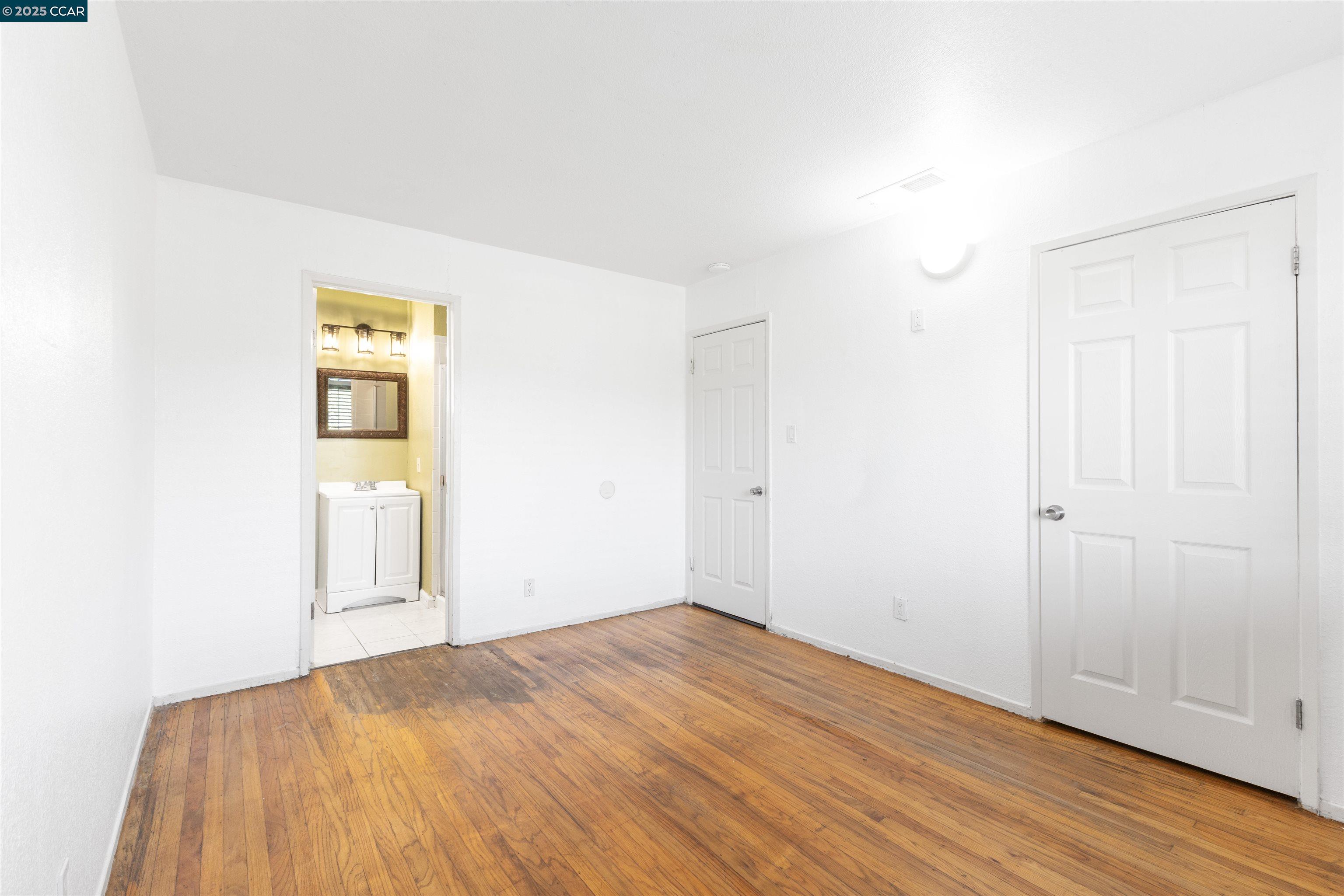 2106 Goff Avenue Pittsburg, CA 94565 - Photo 22 of 27 a view of empty room with wooden floor