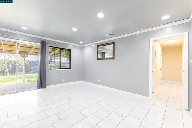 a view of an empty room and window