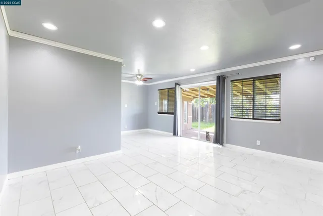 a view of an empty room with a window