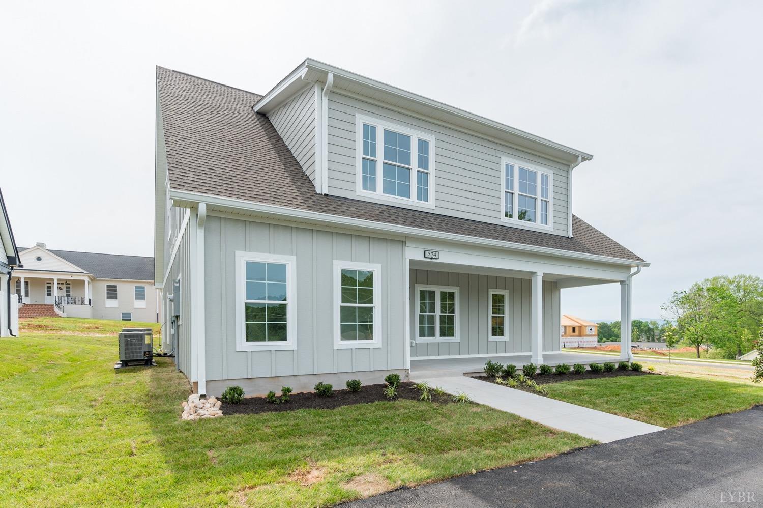574 Leesville Road Lynchburg, VA 24502 - Photo 2 of 54 a front view of a house with a yard