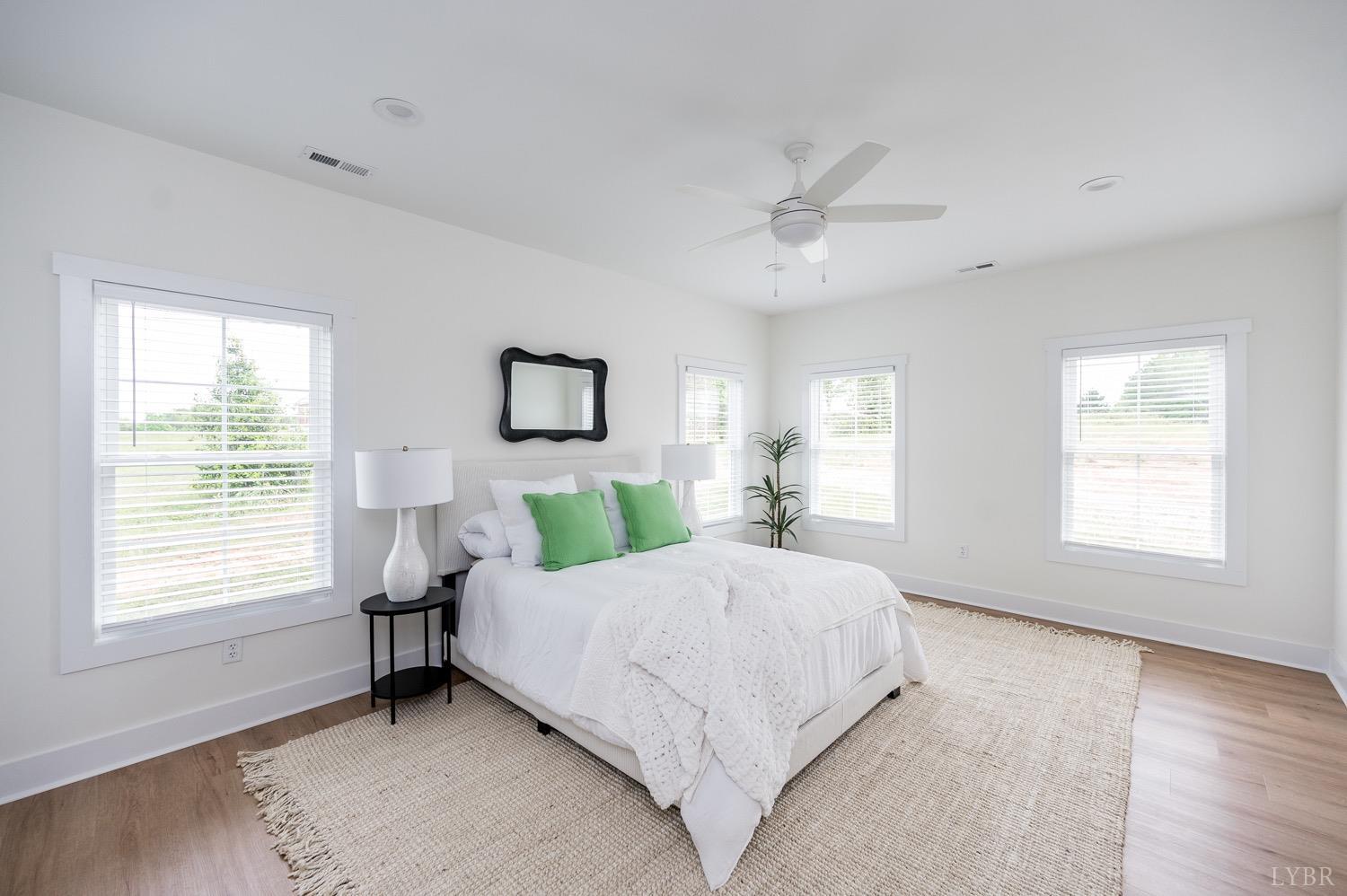 574 Leesville Road Lynchburg, VA 24502 - Photo 24 of 54 a bedroom with a large bed and a window