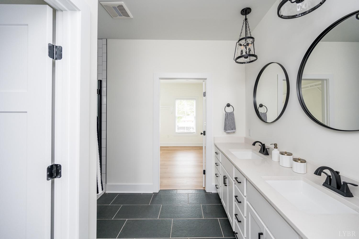 574 Leesville Road Lynchburg, VA 24502 - Photo 26 of 54 a bathroom with a double vanity sink double vanity and a mirror