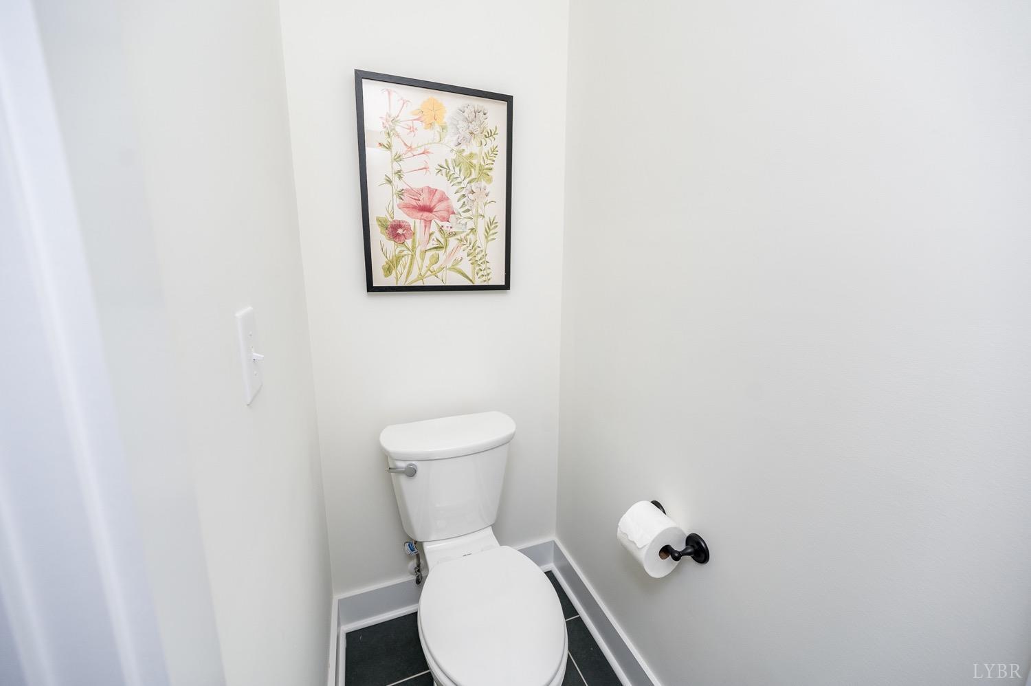 574 Leesville Road Lynchburg, VA 24502 - Photo 32 of 54 a white toilet sitting next to a white wall
