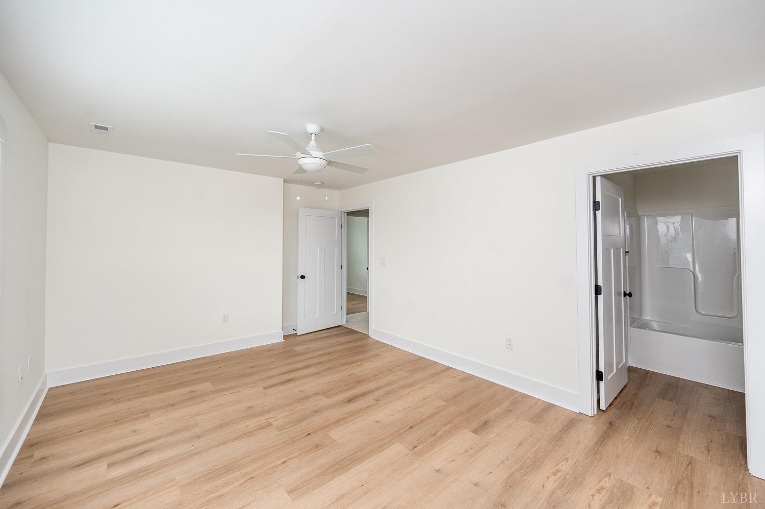 574 Leesville Road Lynchburg, VA 24502 - Photo 39 of 54 a view of an empty room with wooden floor