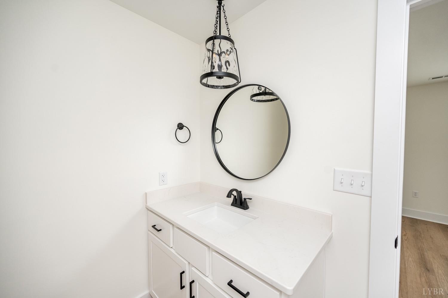 574 Leesville Road Lynchburg, VA 24502 - Photo 41 of 54 a bathroom with a sink and a mirror