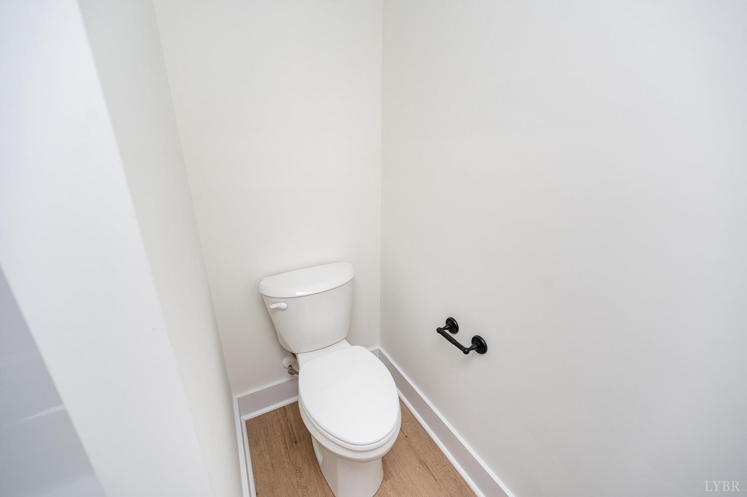 574 Leesville Road Lynchburg, VA 24502 - Photo 42 of 54 a white toilet sitting next to a white wall