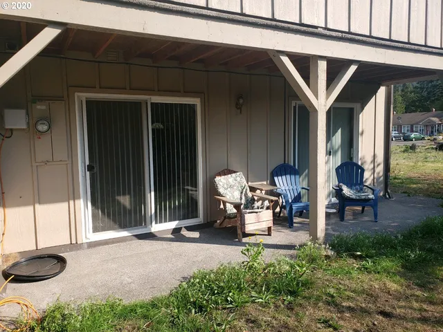 a bench and bench in front of a house