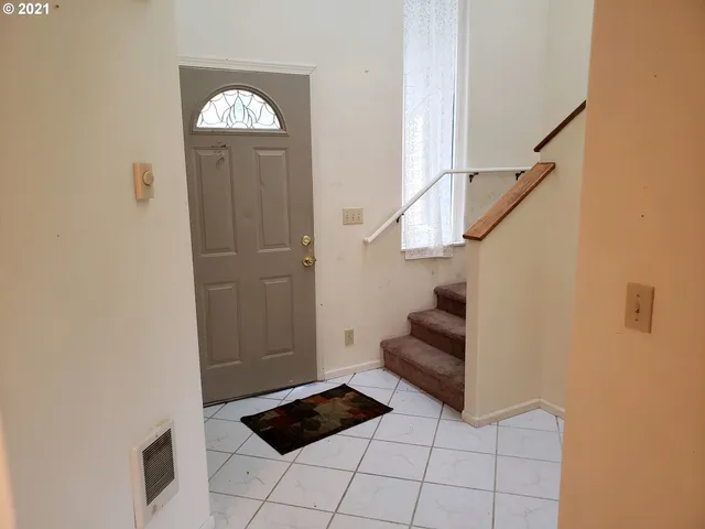 a view of entryway and hall with a window