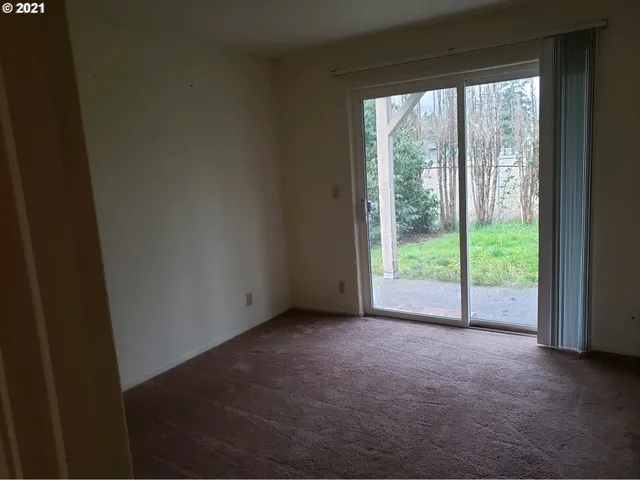 a view of room with a floor to ceiling window